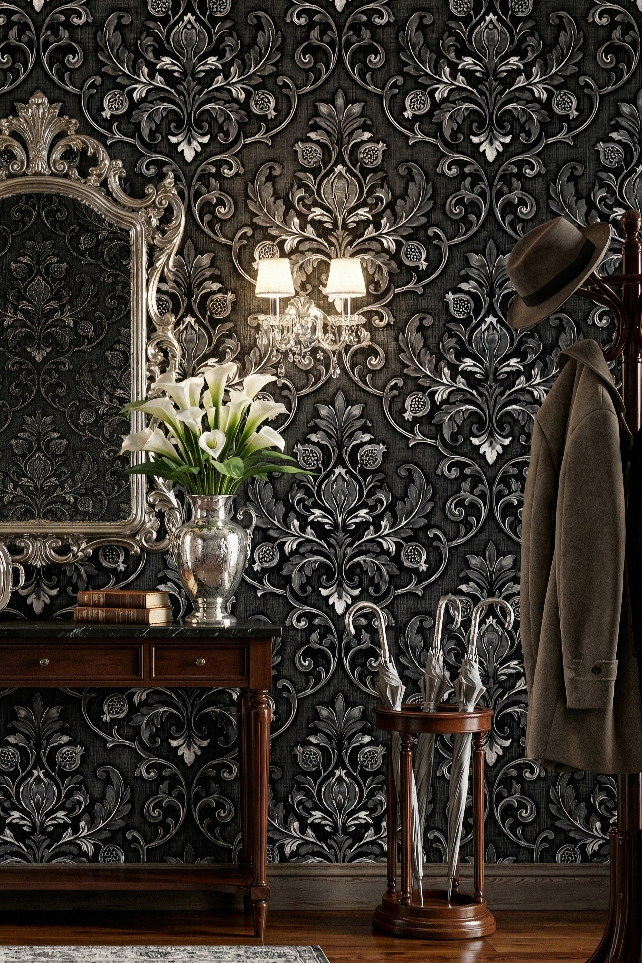 Silver damask scrollwork on black Gothic wallpaper in an entryway.