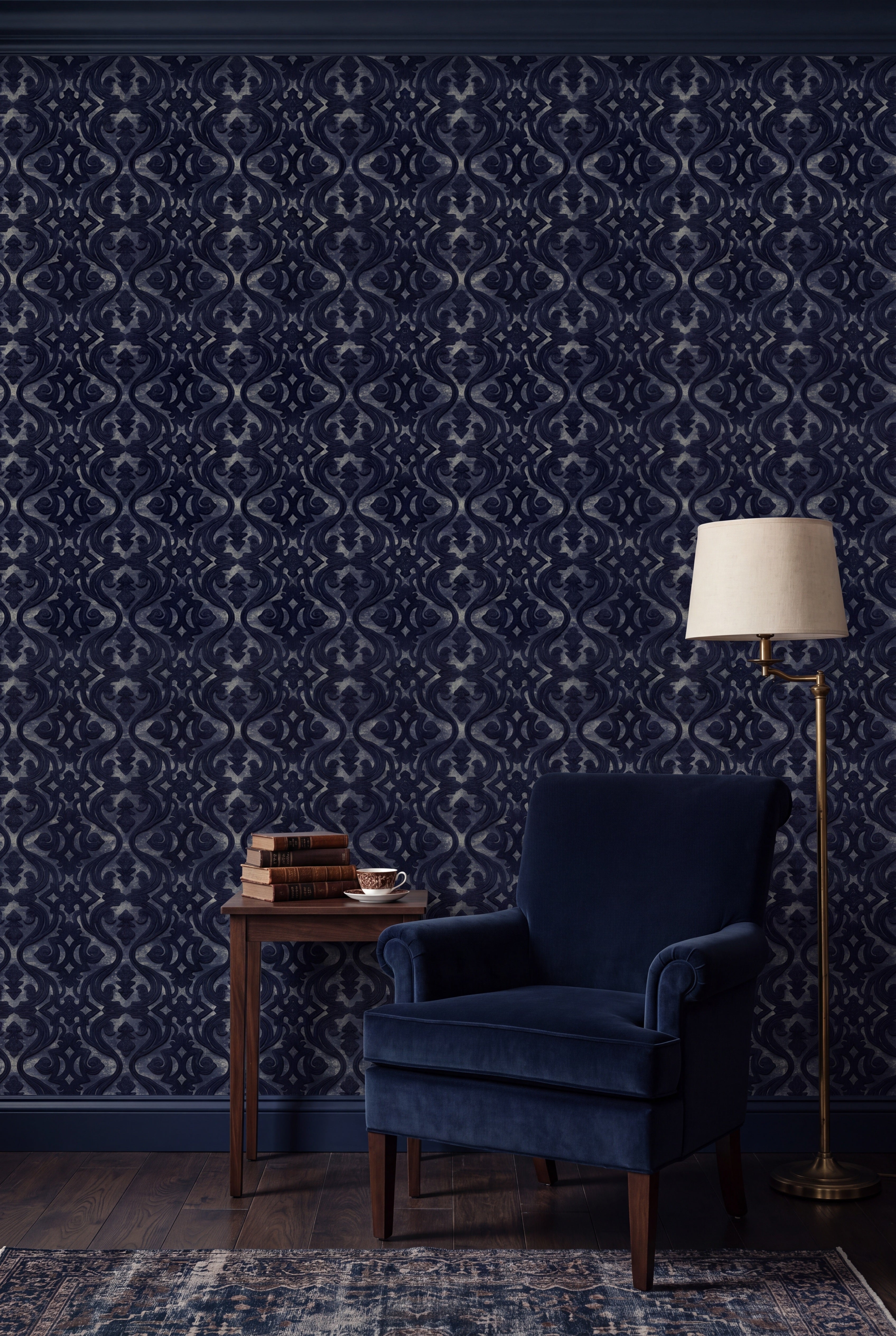 Midnight navy scroll damask wallpaper in a cozy reading nook.