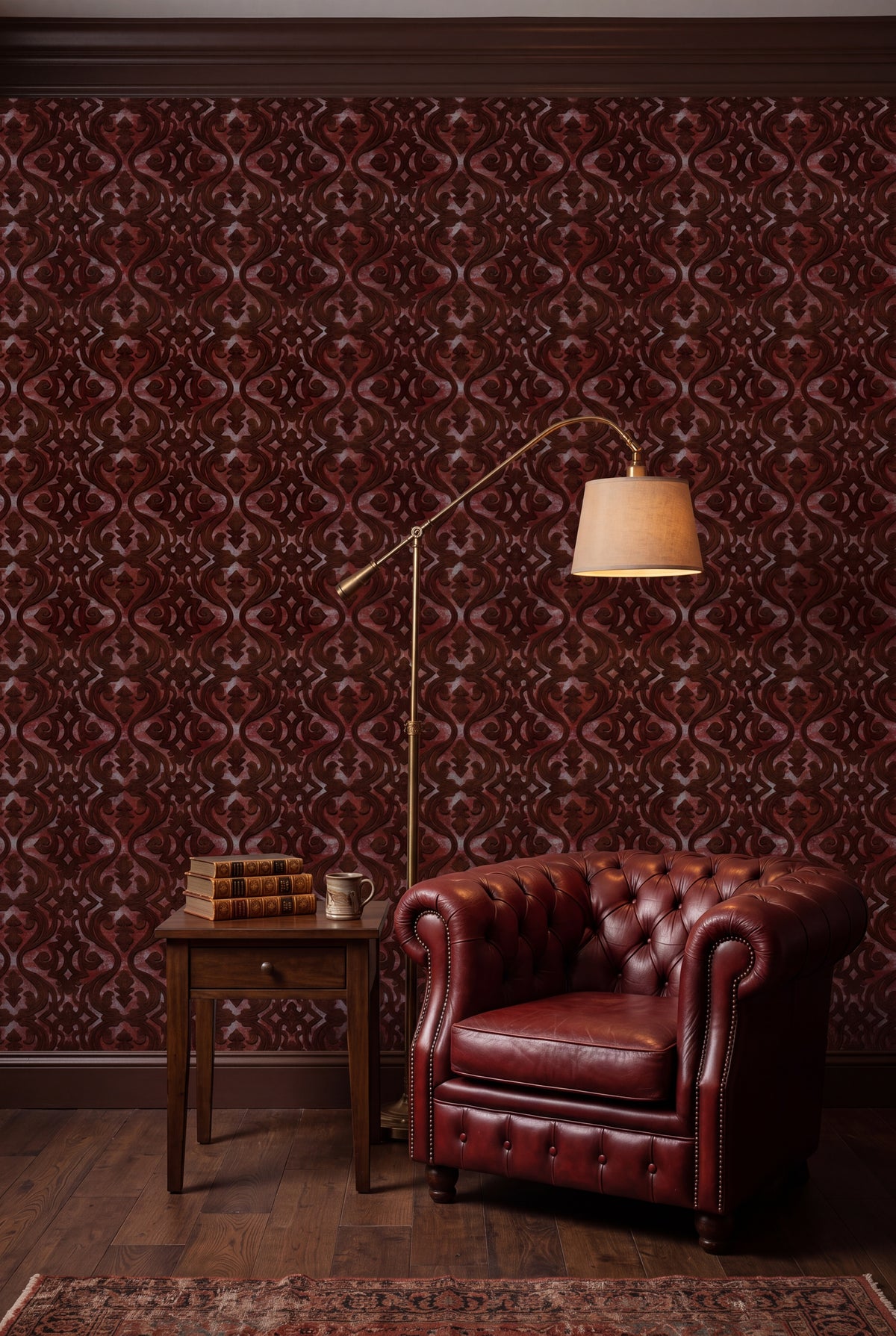 Oxblood red scroll damask wallpaper in a cozy reading nook.