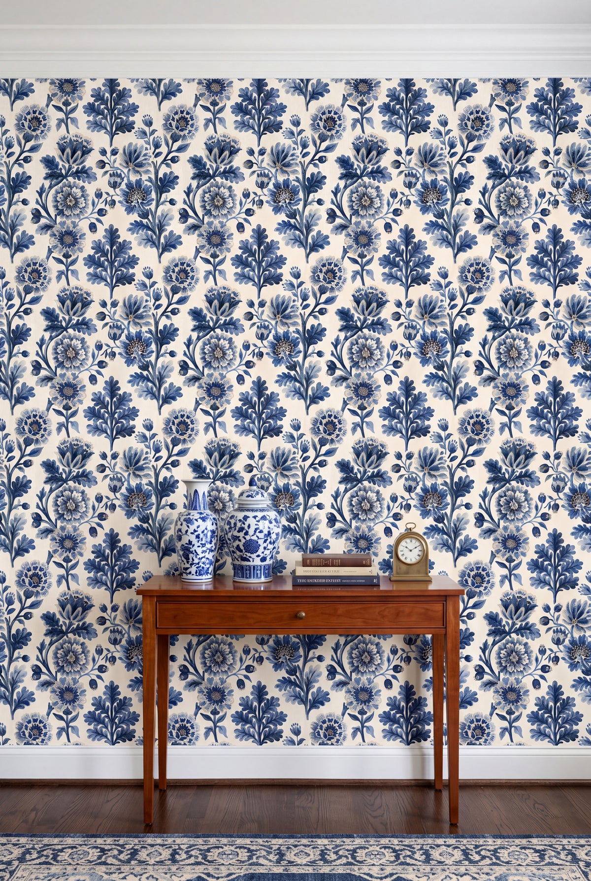 Deep blue monochrome florals on cream wallpaper covering an accent wall.