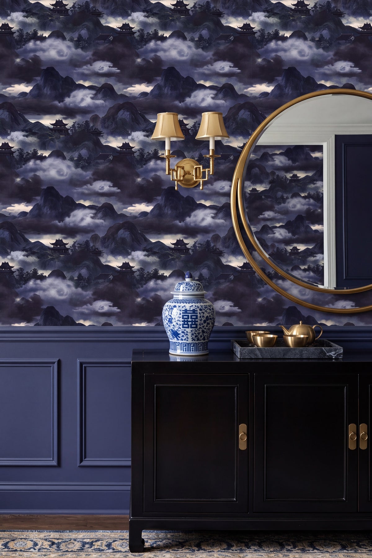 Indigo chinoiserie mountain and pagoda mural wallpaper in a dining room.