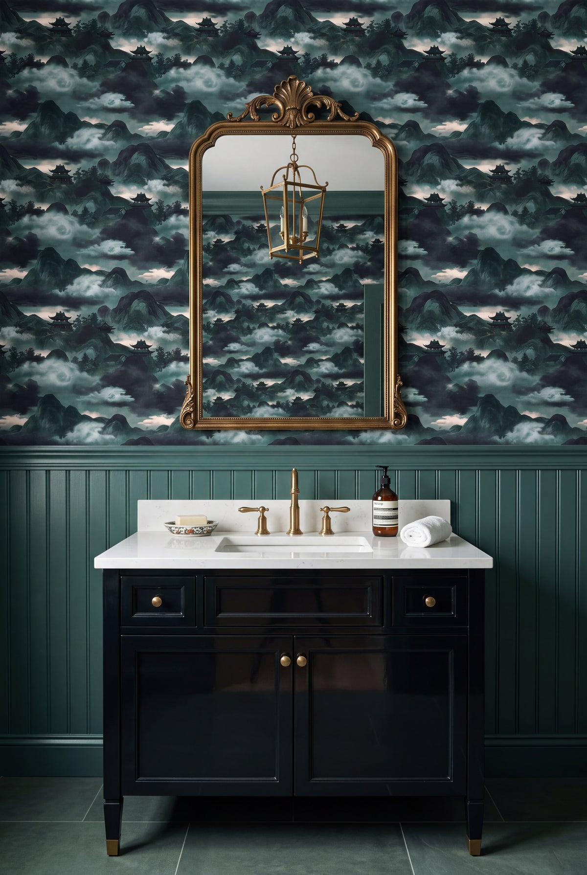 Jade green chinoiserie mountain and pagoda mural wallpaper in a bathroom.