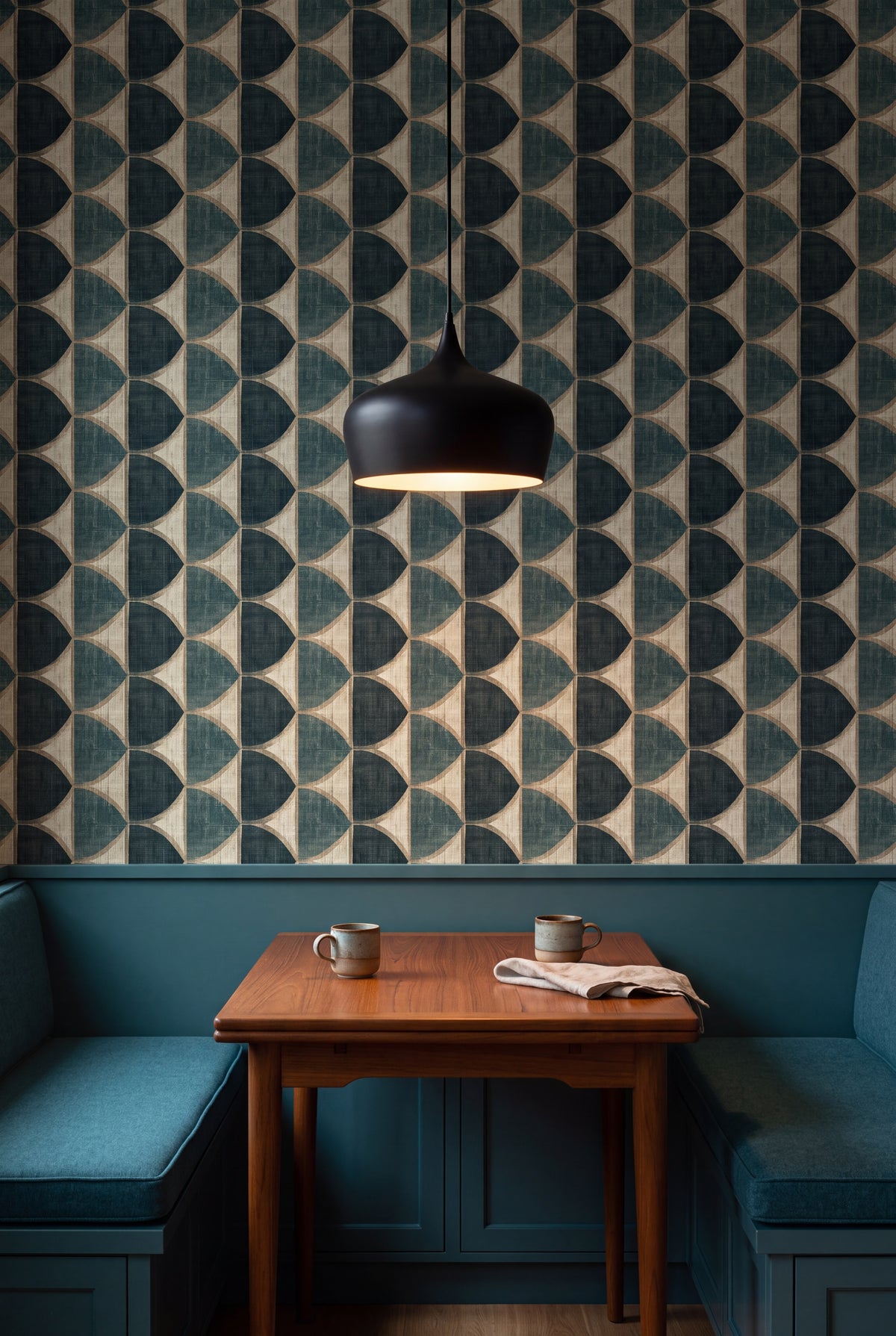 Verdigris Halfmoon wallpaper in teal, gold and cream on a banquette wall.