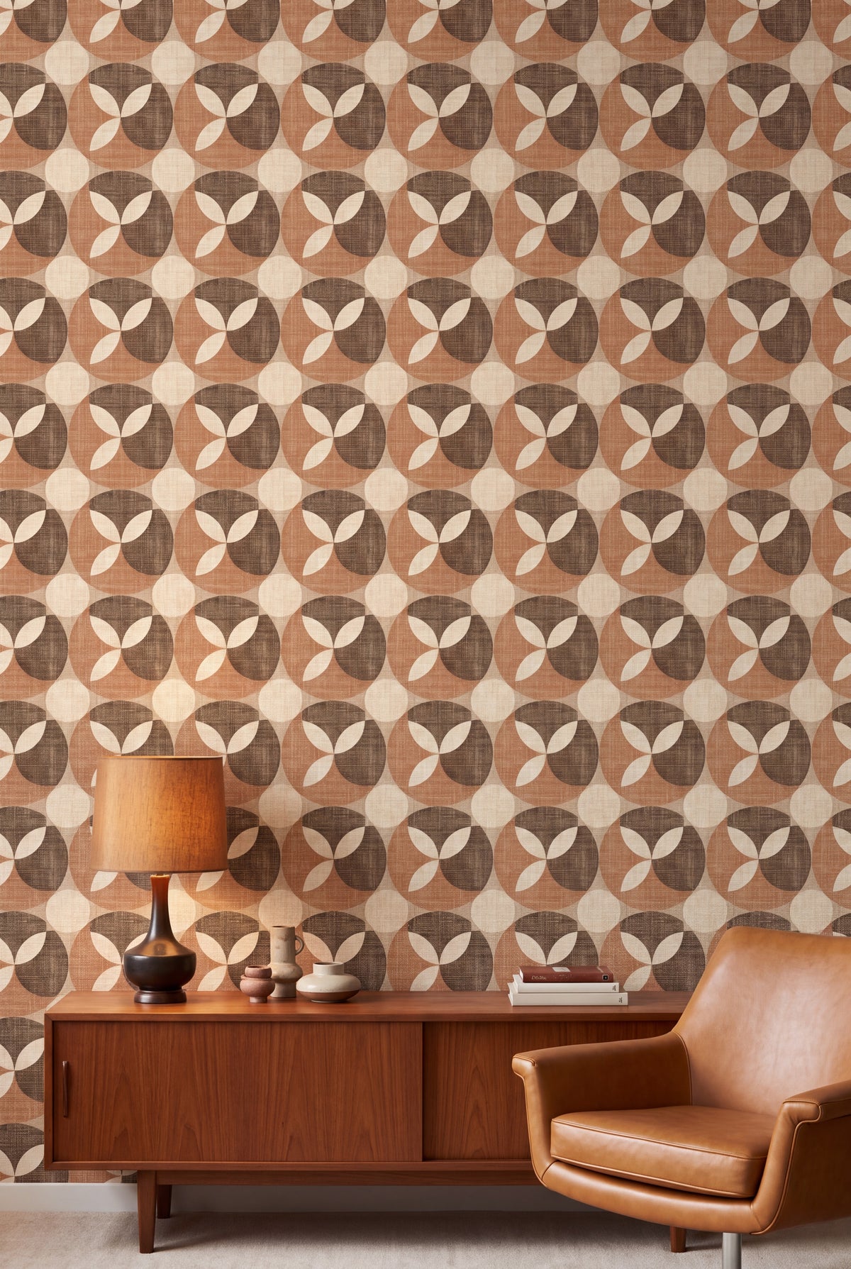 Caramel Petal wallpaper in caramel, chocolate and cream on a living wall.