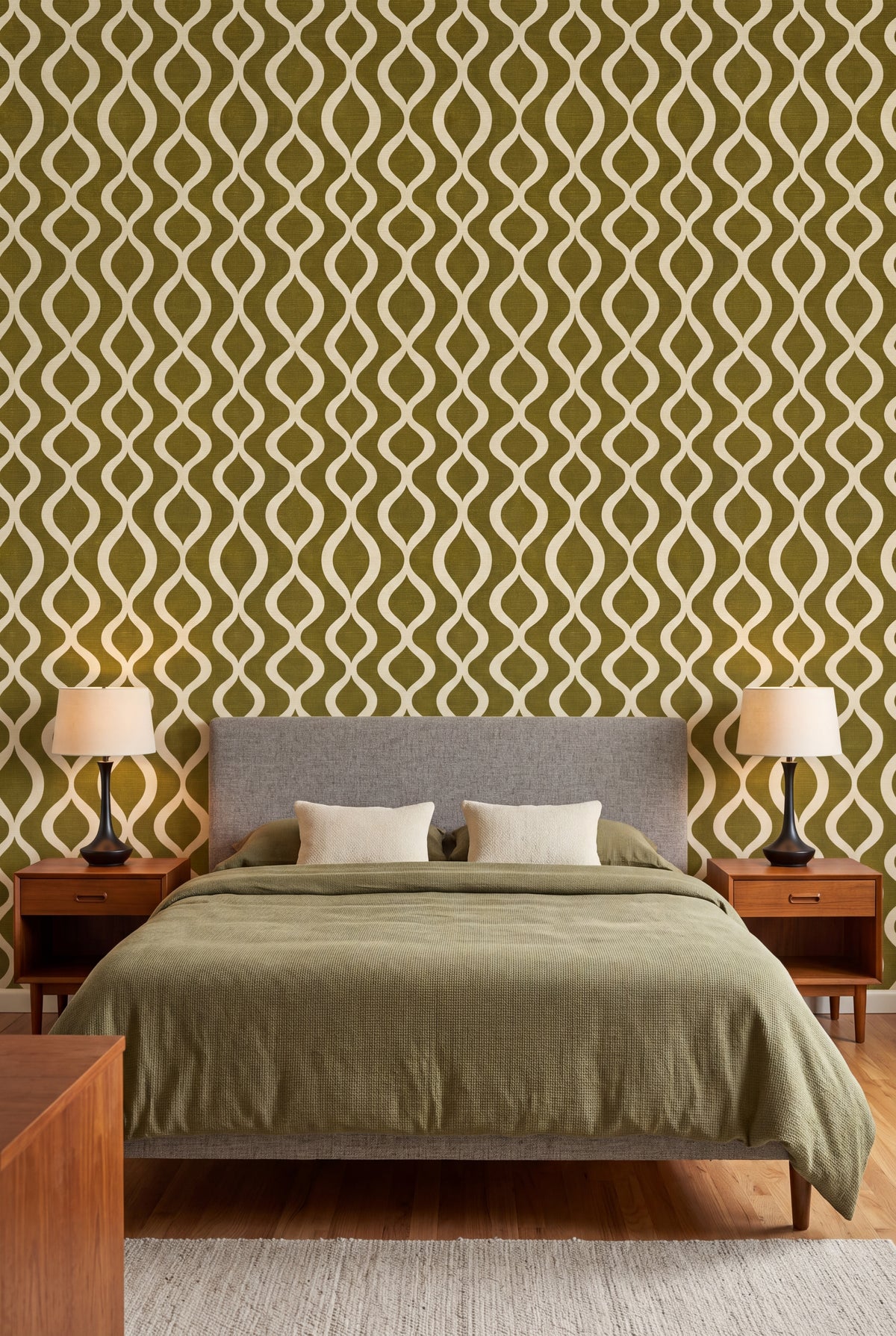 Olive Pendulum wallpaper in cream on olive linen on a bedroom wall.