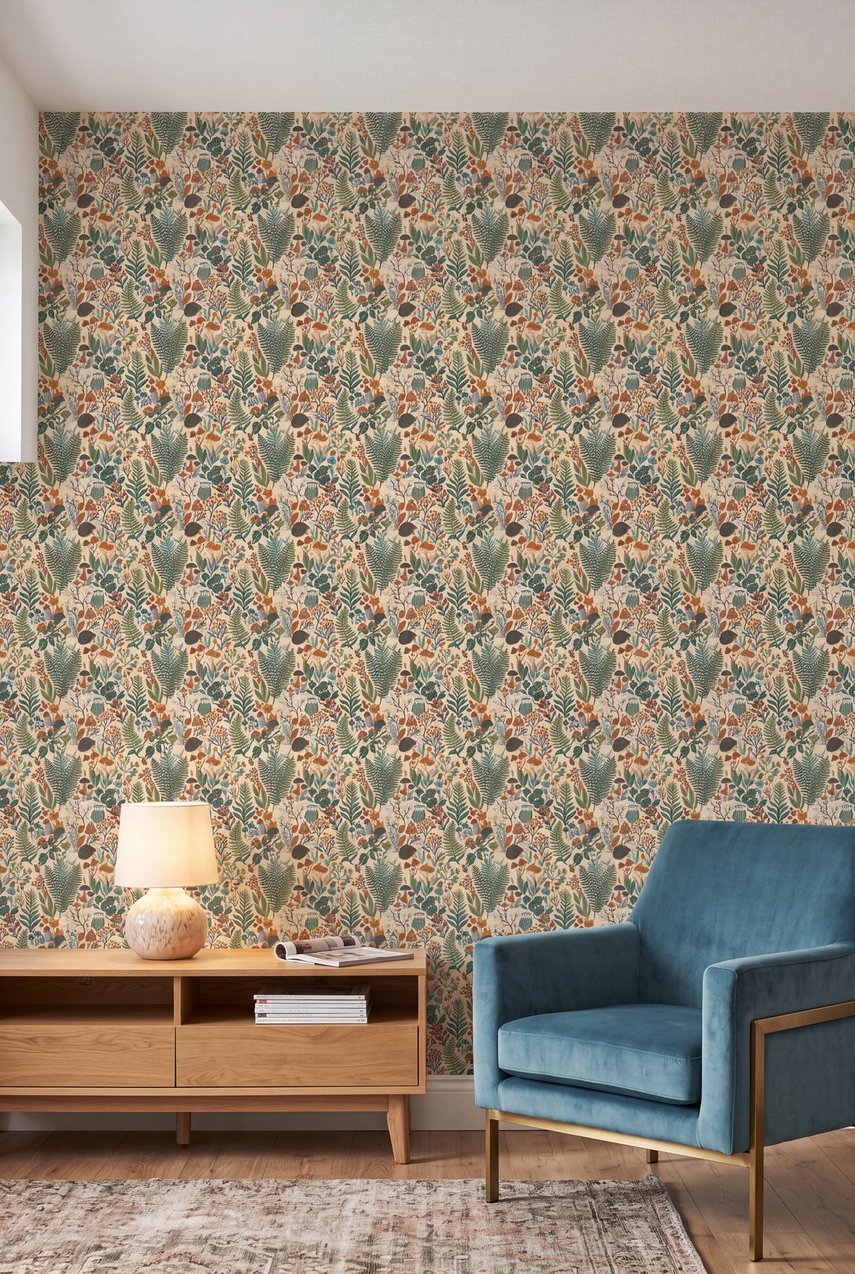 Owl Hollow wallpaper in sage, rust and teal on cream on a living wall.