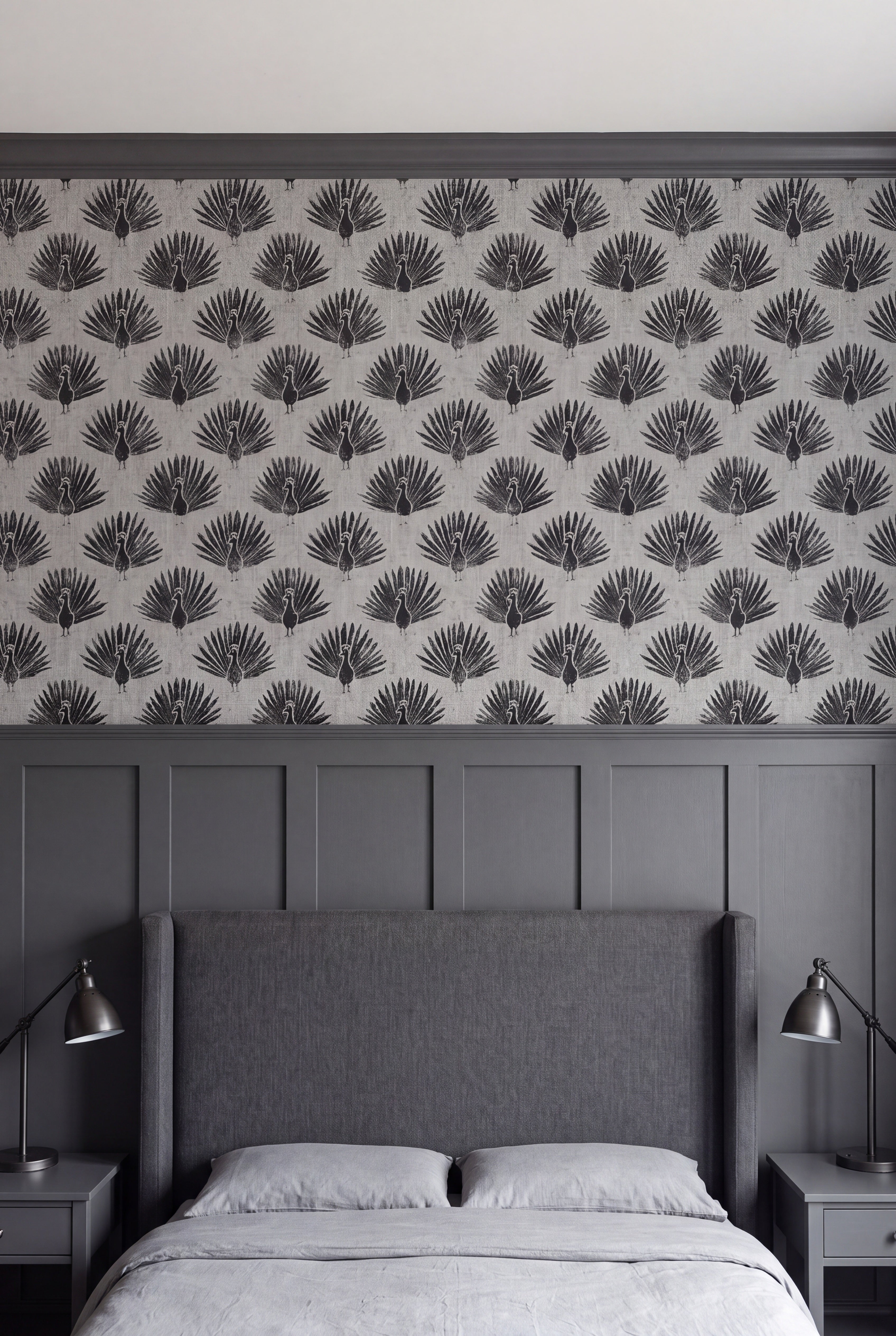 Peacock Noir wallpaper shown in a bedroom