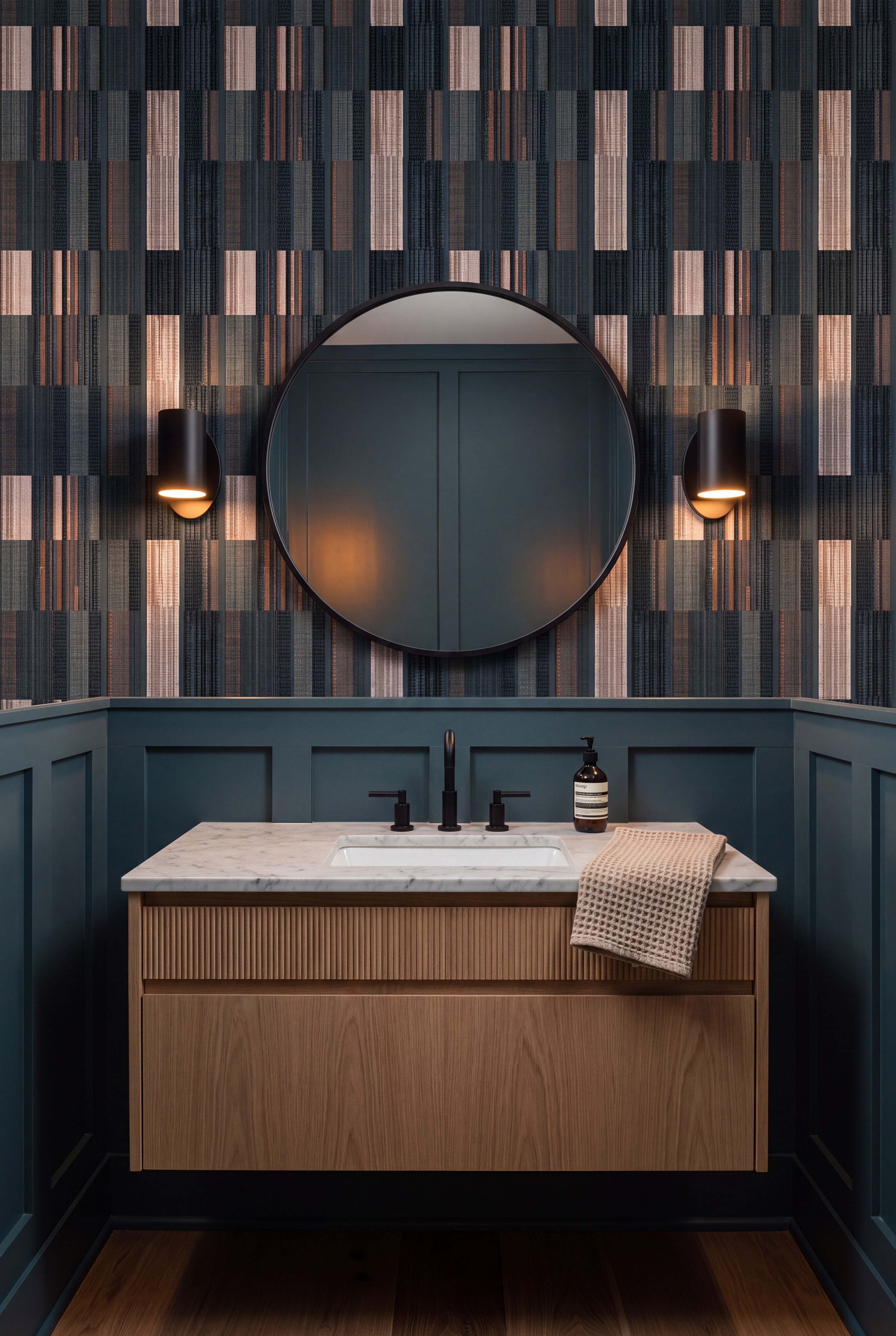 Cinder Ticking wallpaper shown in a powder room