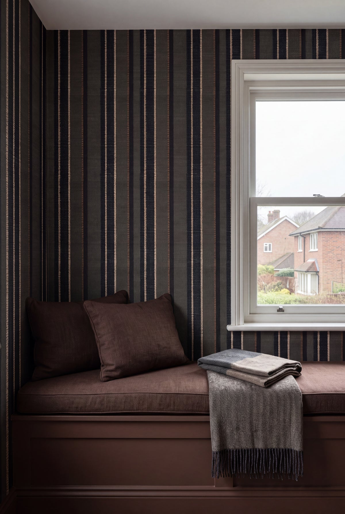 Bracken Weave wallpaper shown in a window seat alcove